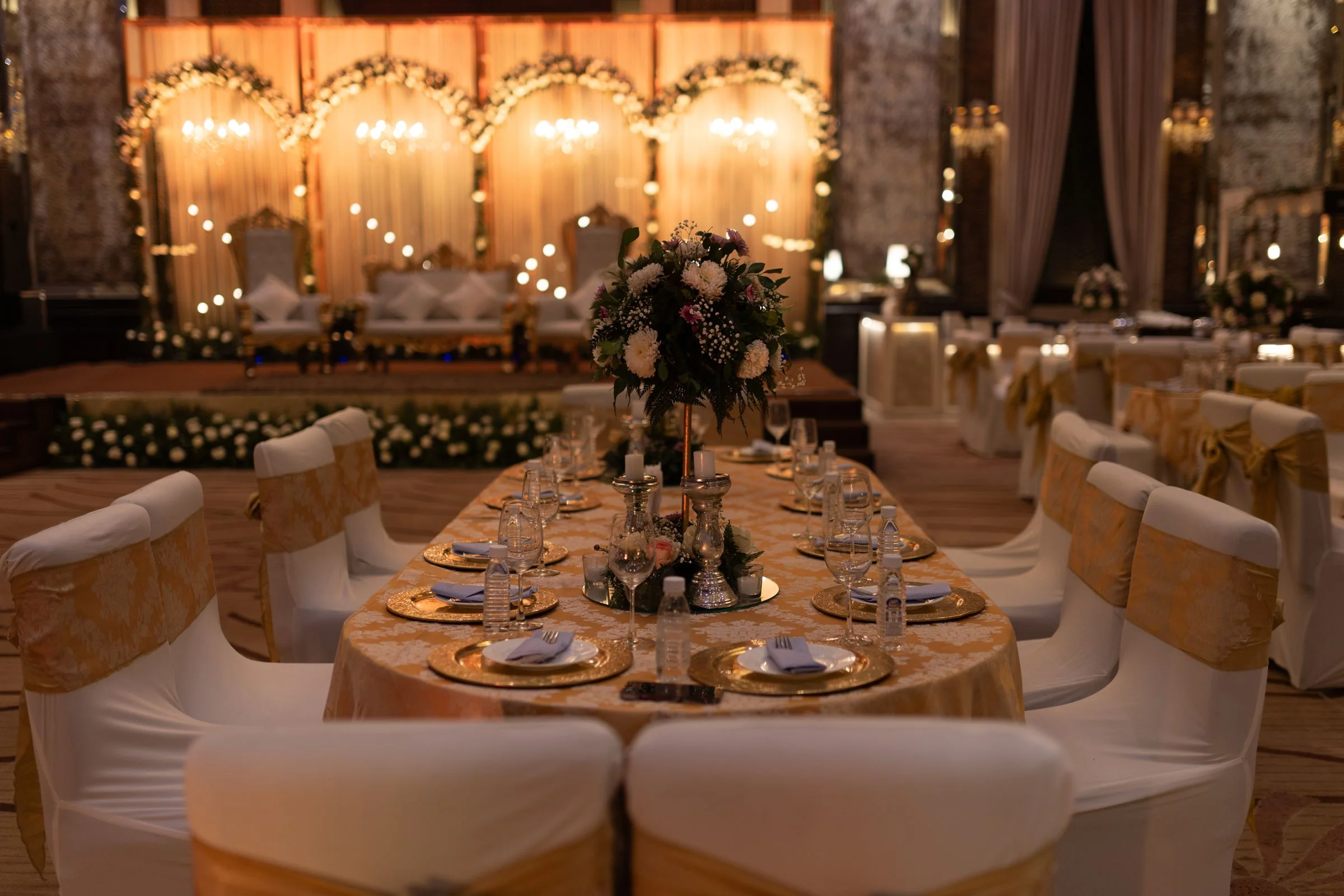 Wedding reception inspiration with candlelight, florals and warm golden details