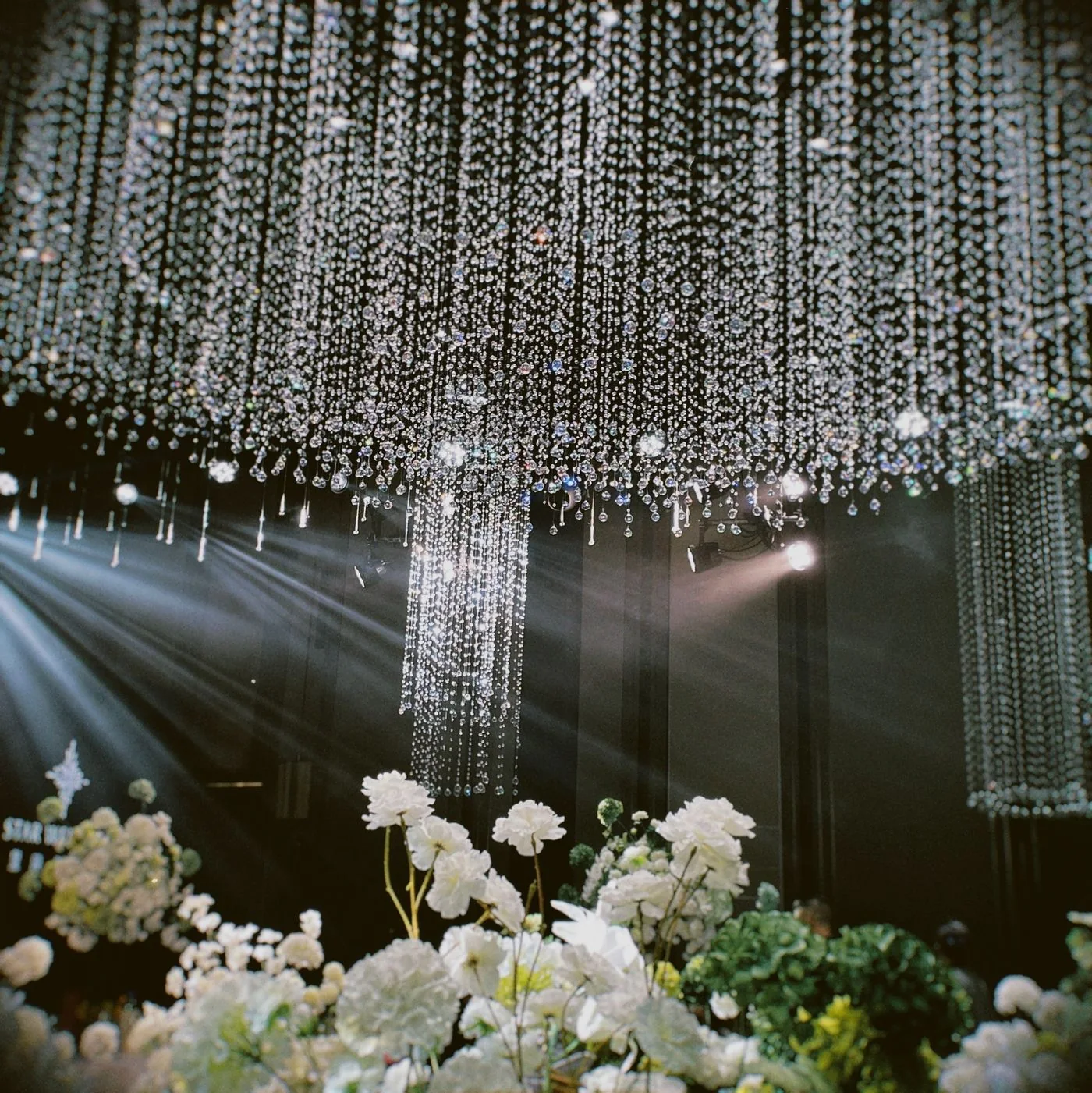 Event design inspiration featuring crystal chandeliers and white flowers