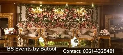 Wedding stage with florals and warm lighting